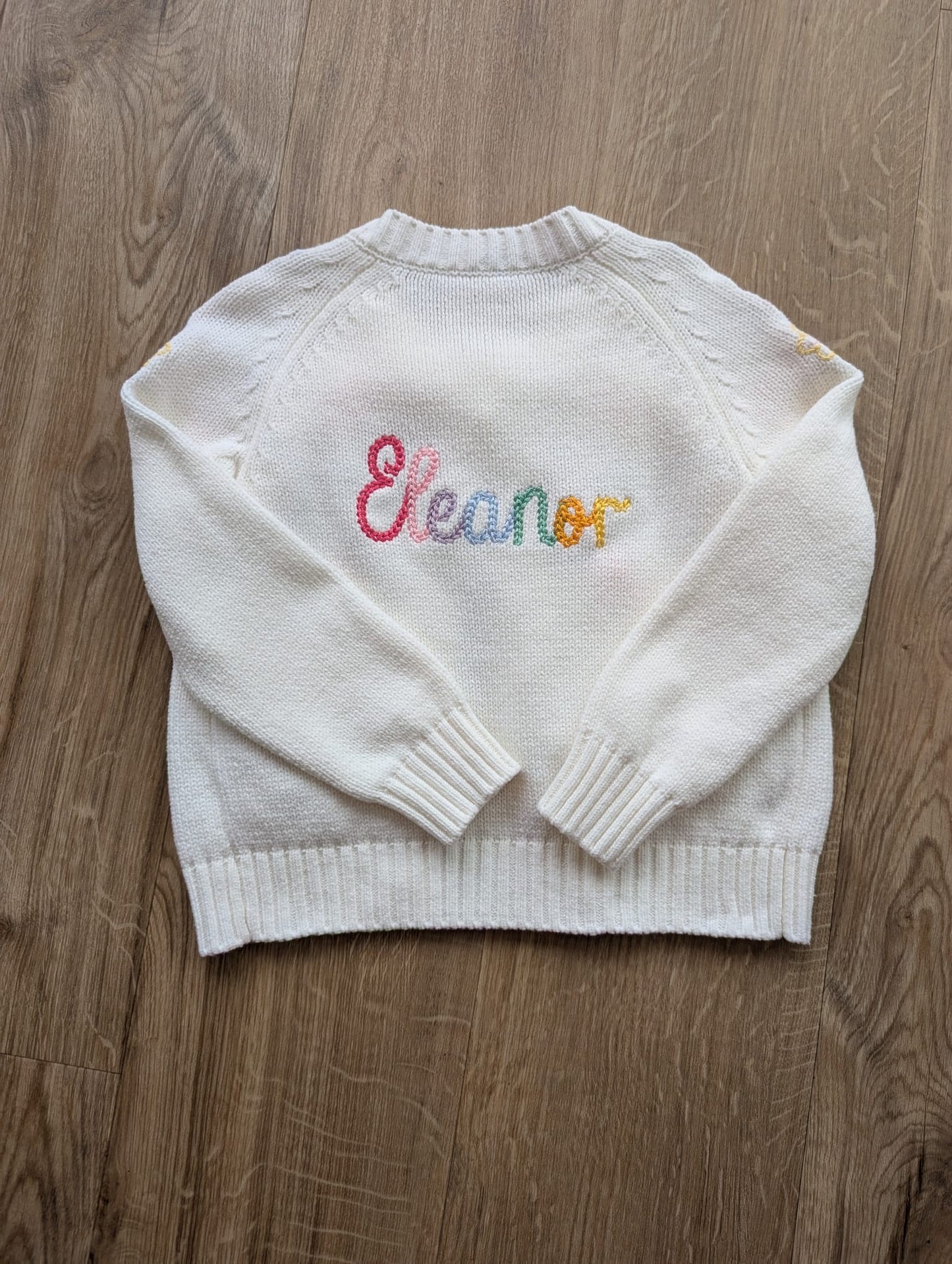 Cardigan with multi-colour rope stitched name